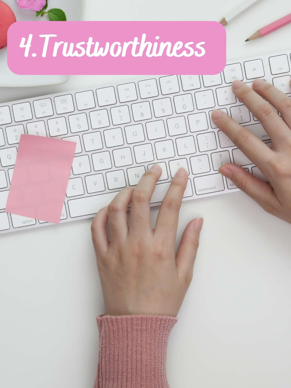 4. Trustworthiness. Hands typing on keyboard with pink sticky note.