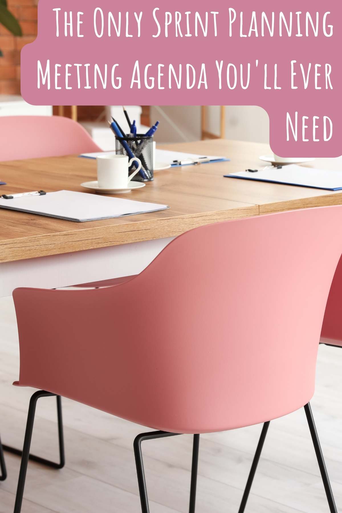 The only sprint planning meeting agenda you'll ever need. Photo of meeting with pink chairs. 